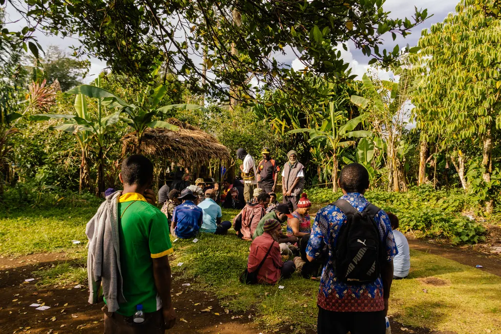 Every Home volunteers sharing the gospel with a village gathering in Papua New Guinea